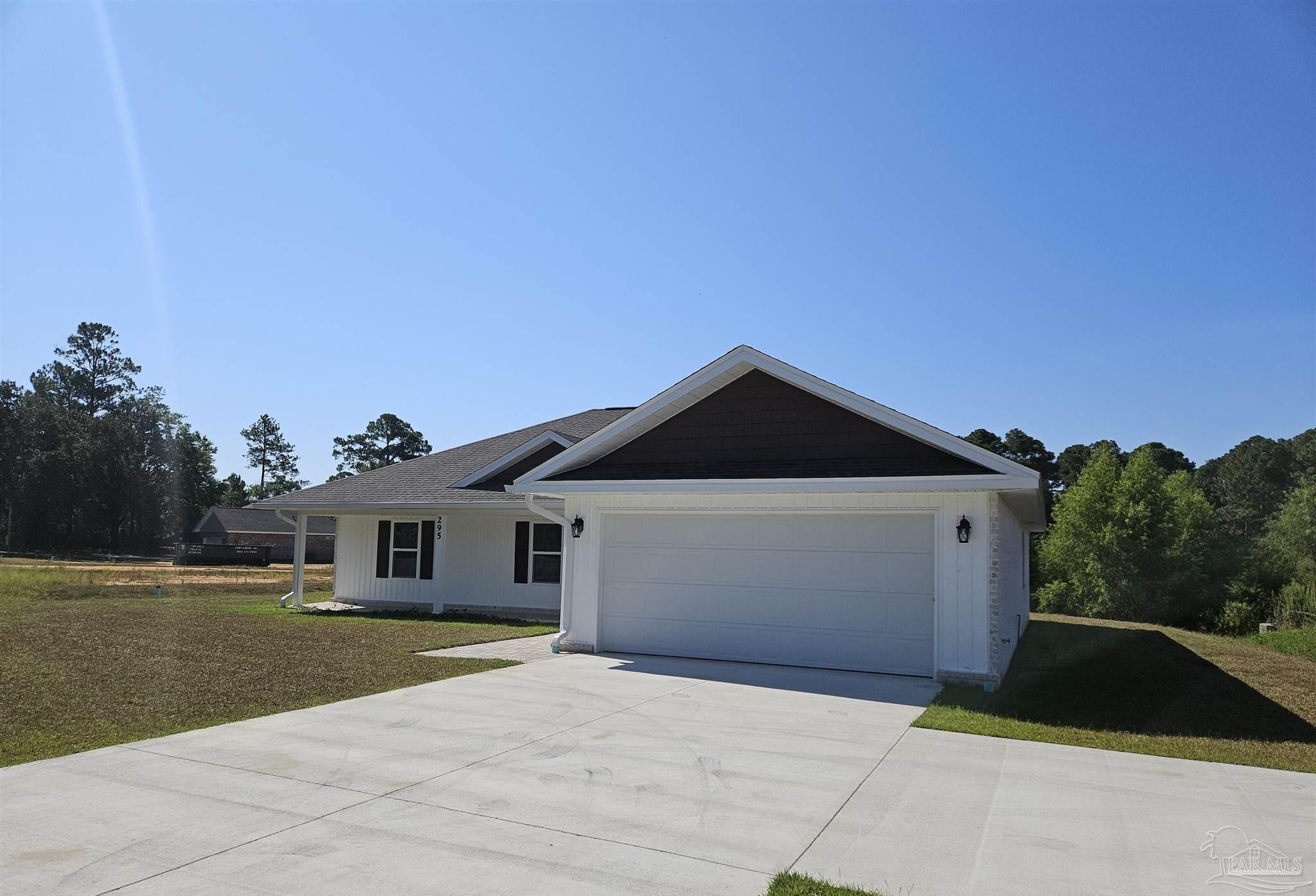 295 West Kingsfield Road Cantonment, FL 32533 - Photo 5 of 32 a front view of a house with a garden