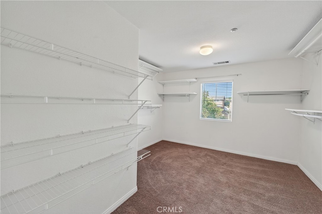 9406 Kentfield Court Riverside, CA 92508 - Photo 50 of 64 Oversized walk-in closet offering plenty of storage and shelving