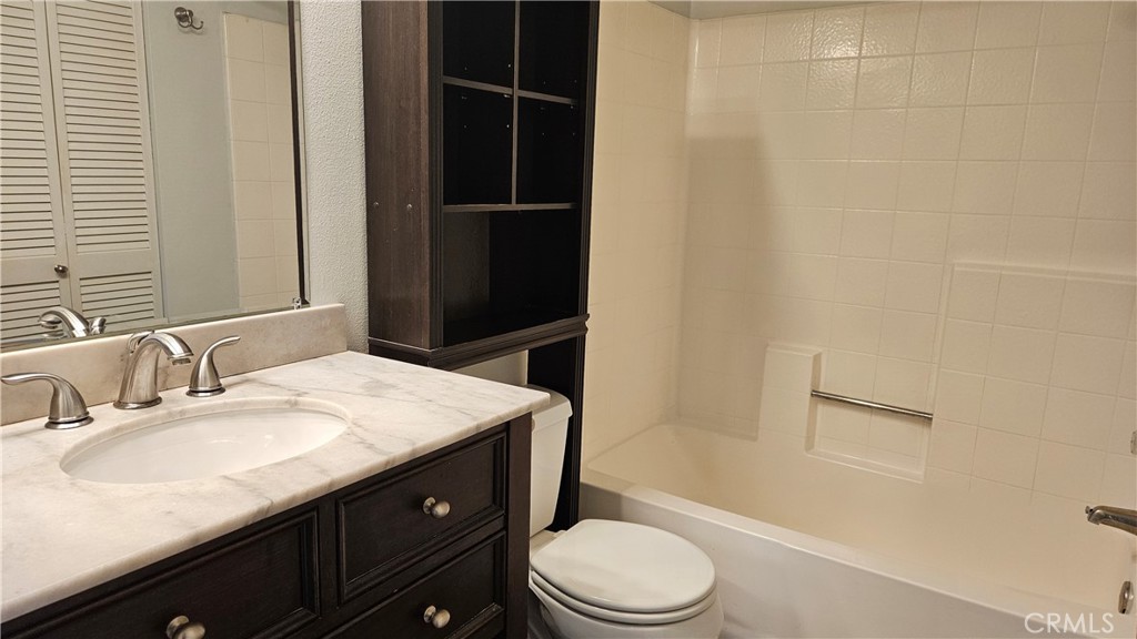 18922 Canyon Summit Lake Forest, CA 92679 - Photo 12 of 32 a bathroom with a sink a toilet and shower