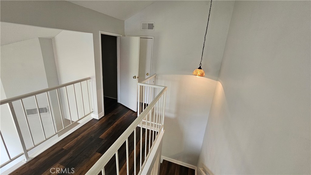 18922 Canyon Summit Lake Forest, CA 92679 - Photo 21 of 32 a walk in closet with wooden floor