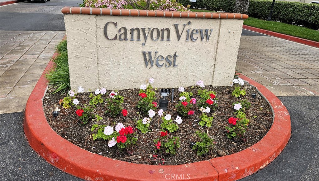 18922 Canyon Summit Lake Forest, CA 92679 - Photo 26 of 32 a sign that is in front of flowers