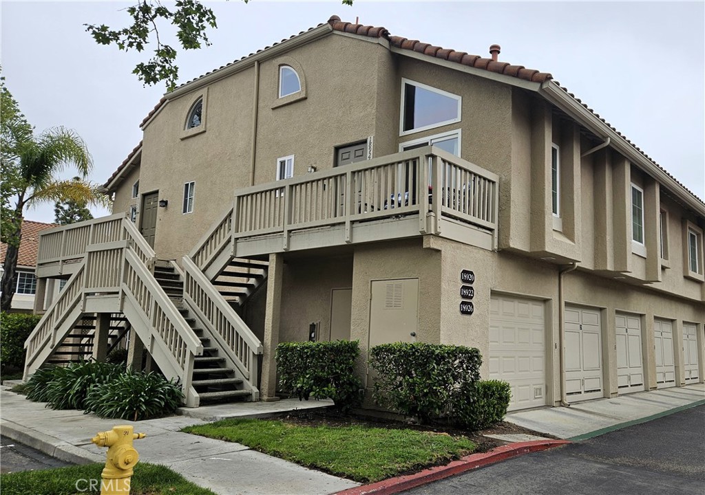 18922 Canyon Summit Lake Forest, CA 92679 - Photo 3 of 32 a front view of a house with a yard