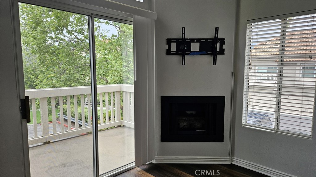 18922 Canyon Summit Lake Forest, CA 92679 - Photo 5 of 32 a view of a livingroom with a floor to ceiling window and a fireplace