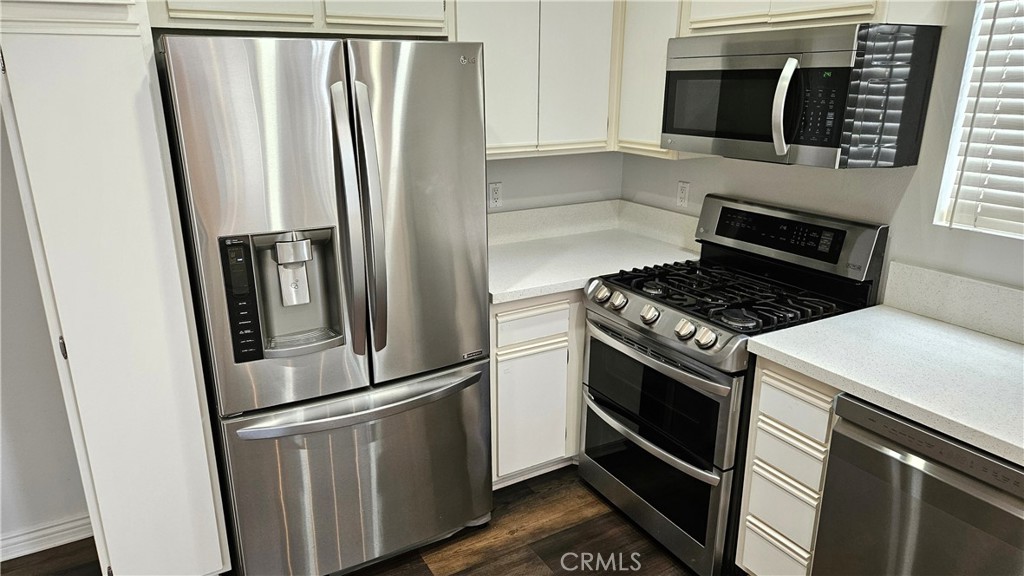18922 Canyon Summit Lake Forest, CA 92679 - Photo 6 of 32 a kitchen with stainless steel appliances granite countertop a refrigerator stove and microwave
