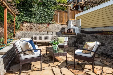 a view of a chairs and table in the patio