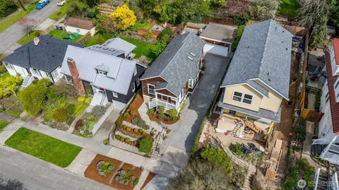an aerial view of a residential apartment building with a yard