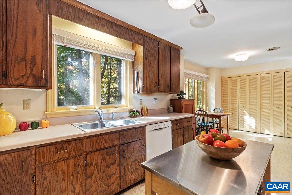 103 Vicar Court Charlottesville, VA 22901 - Photo 16 of 74 a kitchen with a sink and dishwasher with a large window