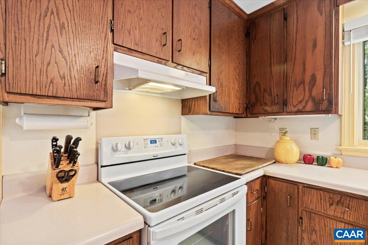 103 Vicar Court Charlottesville, VA 22901 - Photo 17 of 74 a kitchen with a stove and cabinets
