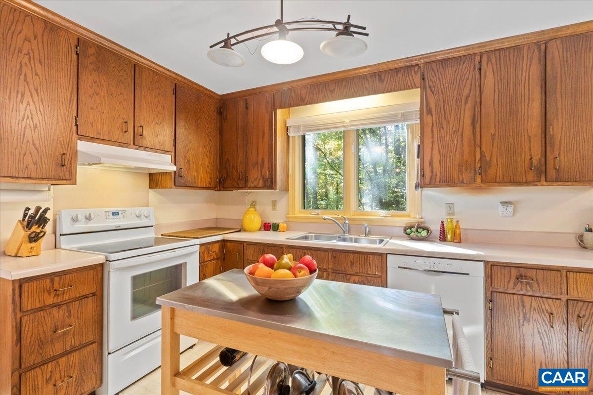 103 Vicar Court Charlottesville, VA 22901 - Photo 21 of 74 a kitchen with cabinets a sink and appliances