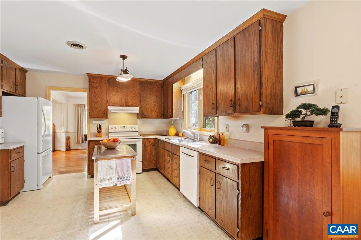103 Vicar Court Charlottesville, VA 22901 - Photo 27 of 74 a kitchen with stainless steel appliances sink stove refrigerator and cabinets