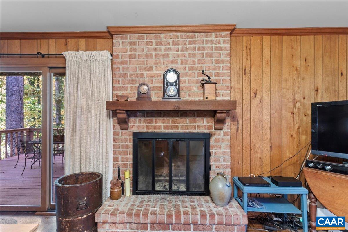 103 Vicar Court Charlottesville, VA 22901 - Photo 31 of 74 a living room with furniture a flat screen tv and a fireplace
