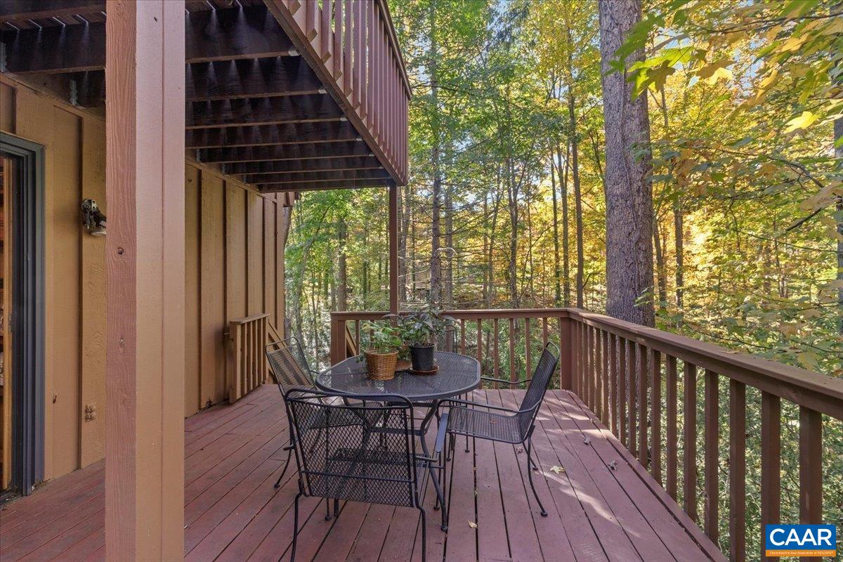 103 Vicar Court Charlottesville, VA 22901 - Photo 35 of 74 a view of a balcony with furniture and wooden floor