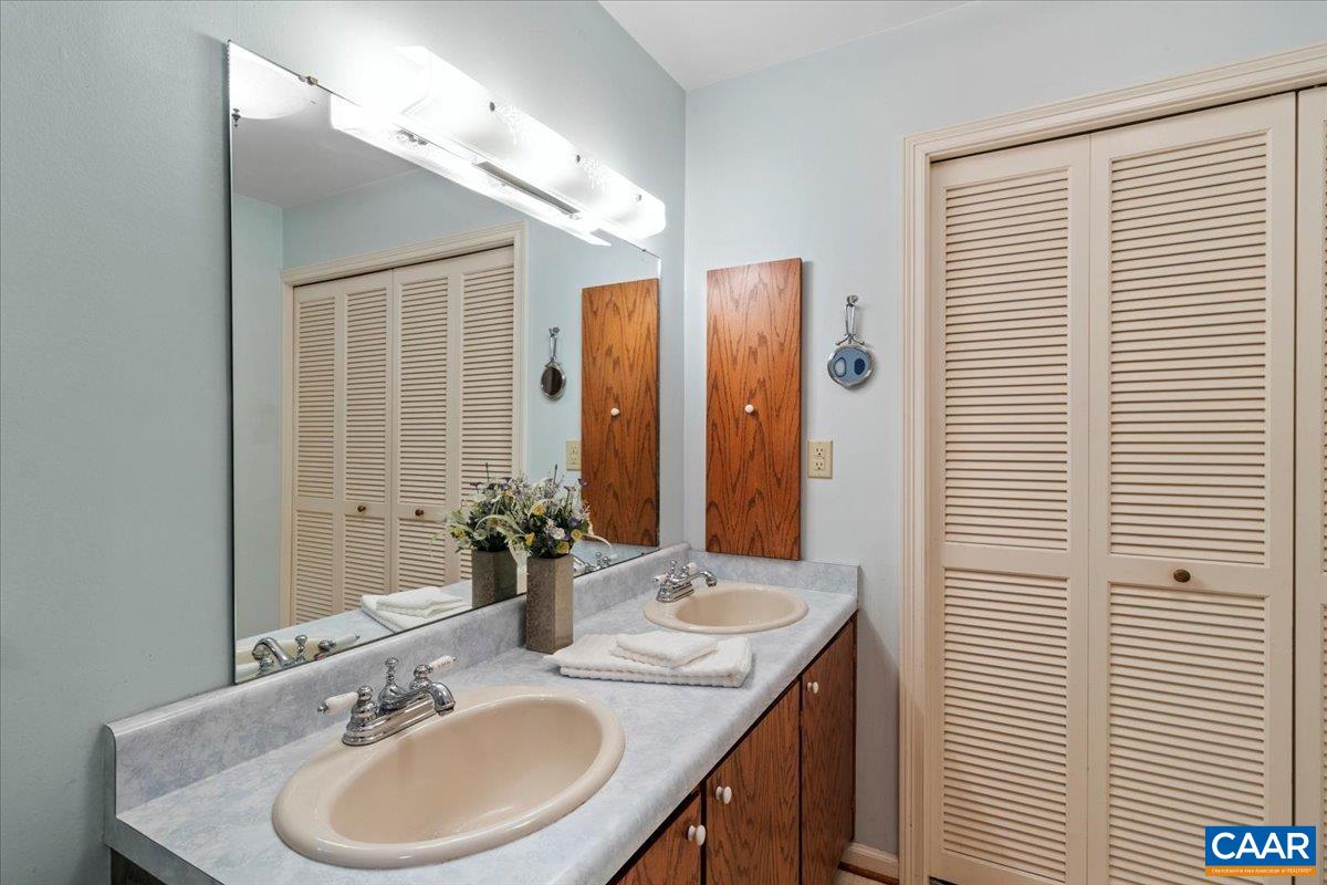 103 Vicar Court Charlottesville, VA 22901 - Photo 46 of 74 a bathroom with a sink double vanity and a mirror
