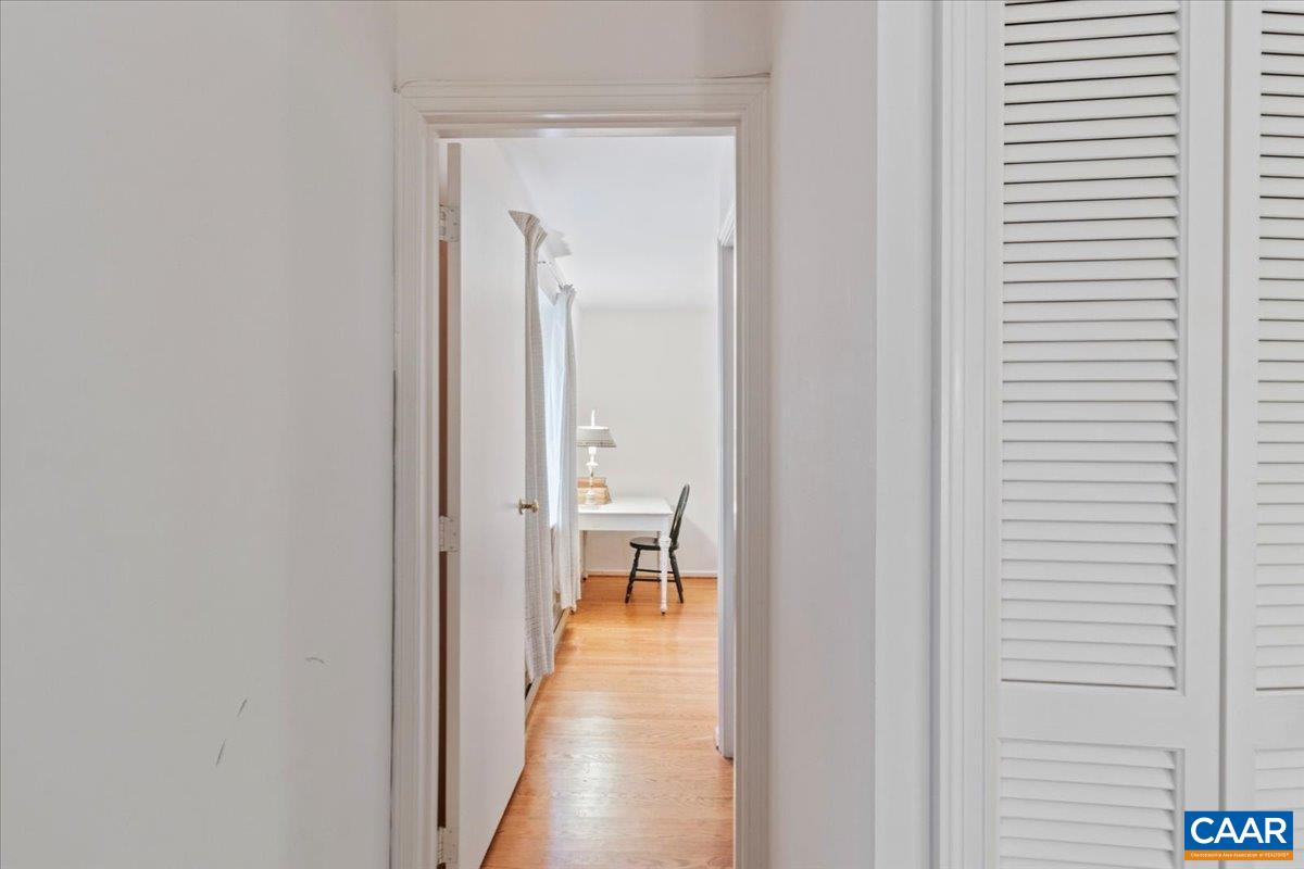 103 Vicar Court Charlottesville, VA 22901 - Photo 48 of 74 a view of a hallway with wooden floor and a bathroom