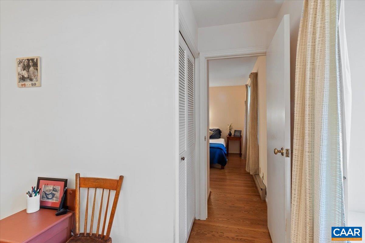 103 Vicar Court Charlottesville, VA 22901 - Photo 49 of 74 a hallway with wooden floor windows and a livingroom