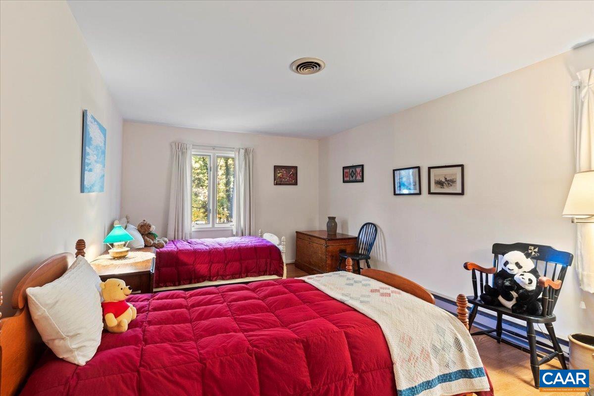 103 Vicar Court Charlottesville, VA 22901 - Photo 56 of 74 a bedroom with two beds and a window