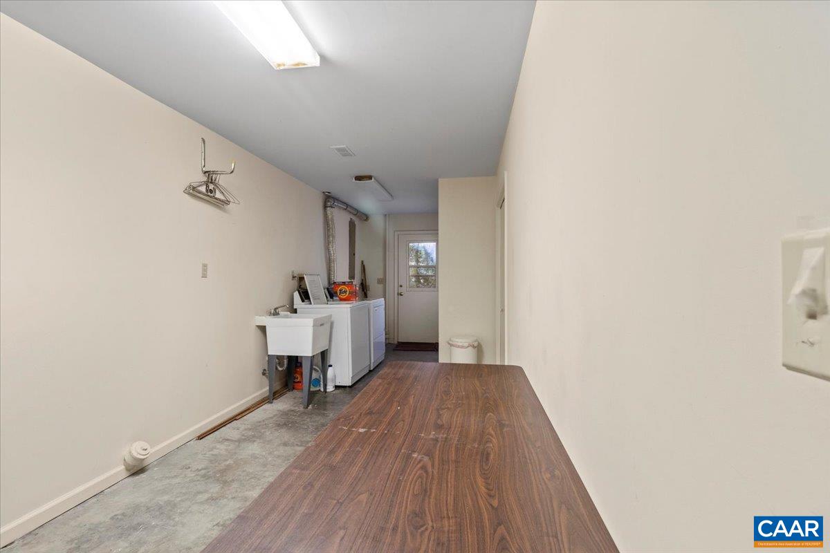 103 Vicar Court Charlottesville, VA 22901 - Photo 65 of 74 a view of a bedroom with wooden floor and furniture