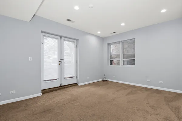 a view of an empty room with a window