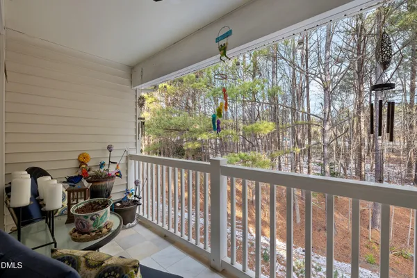 a view of a two chairs in the balcony