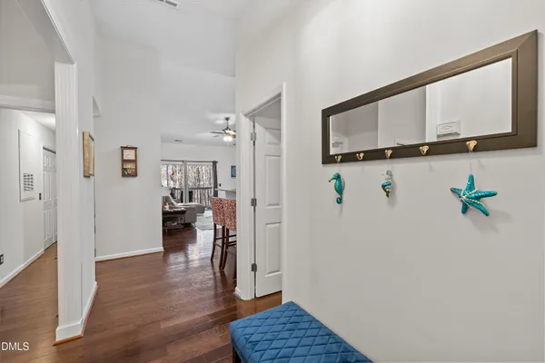 a view of hallway with livingroom and furniture