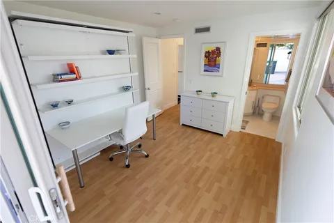 a bathroom with a granite countertop toilet sink and shower