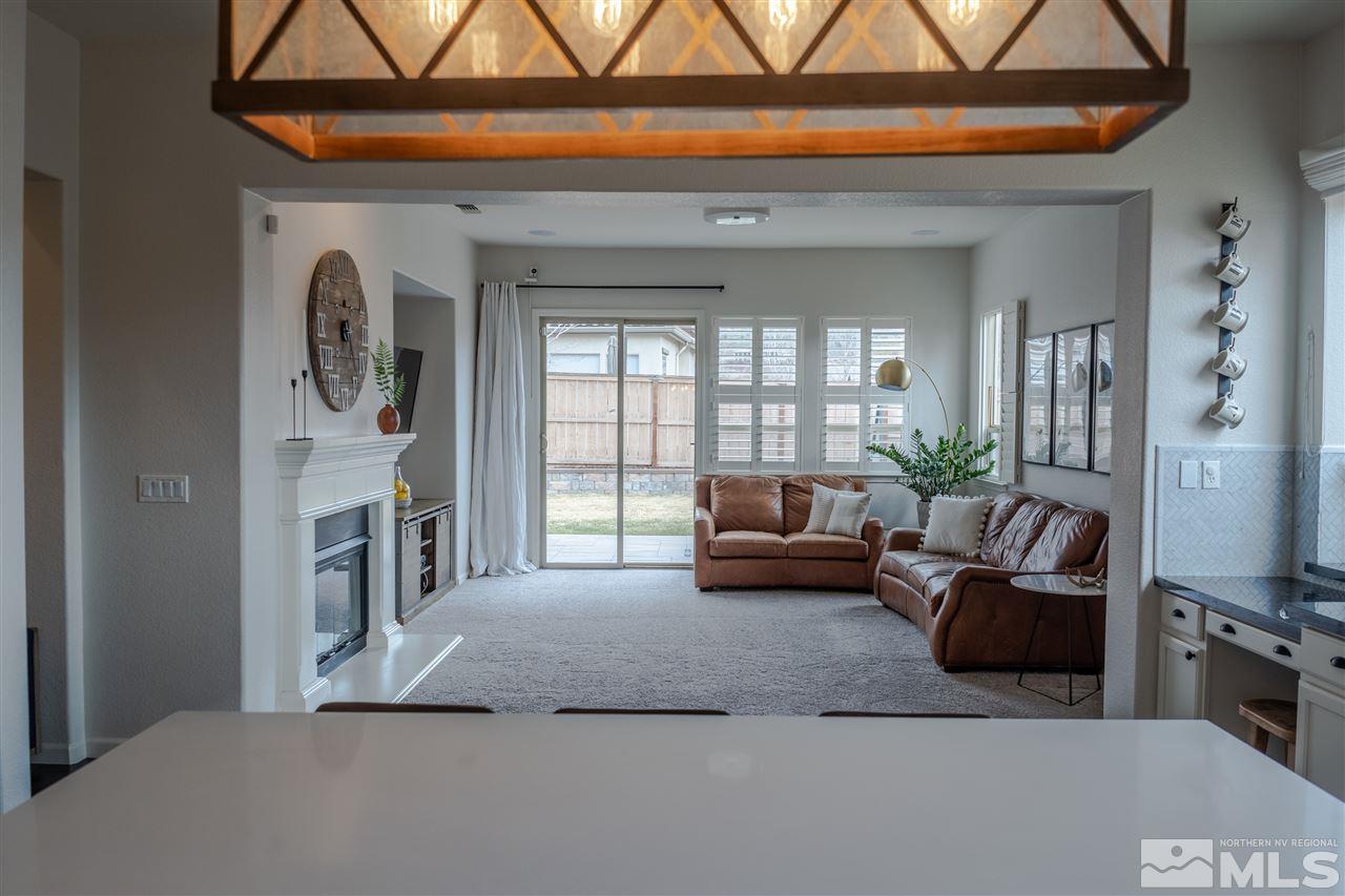 10590 Apple Mill Court Reno, NV 89521 - Photo 6 of 19 a living room with furniture and a fireplace