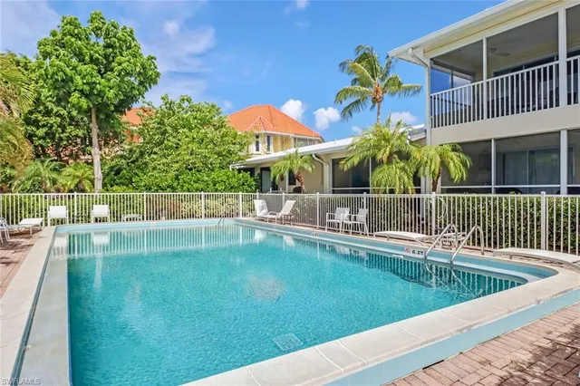 a view of a balcony with a yard