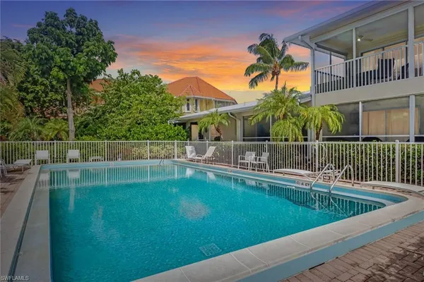 a view of a balcony with a yard