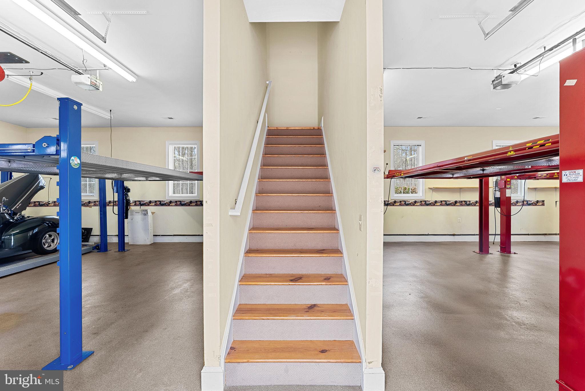 11913 Chapel Road Clifton, VA 20124 - Photo 118 of 124 a view of staircase with a rug and a view of a building