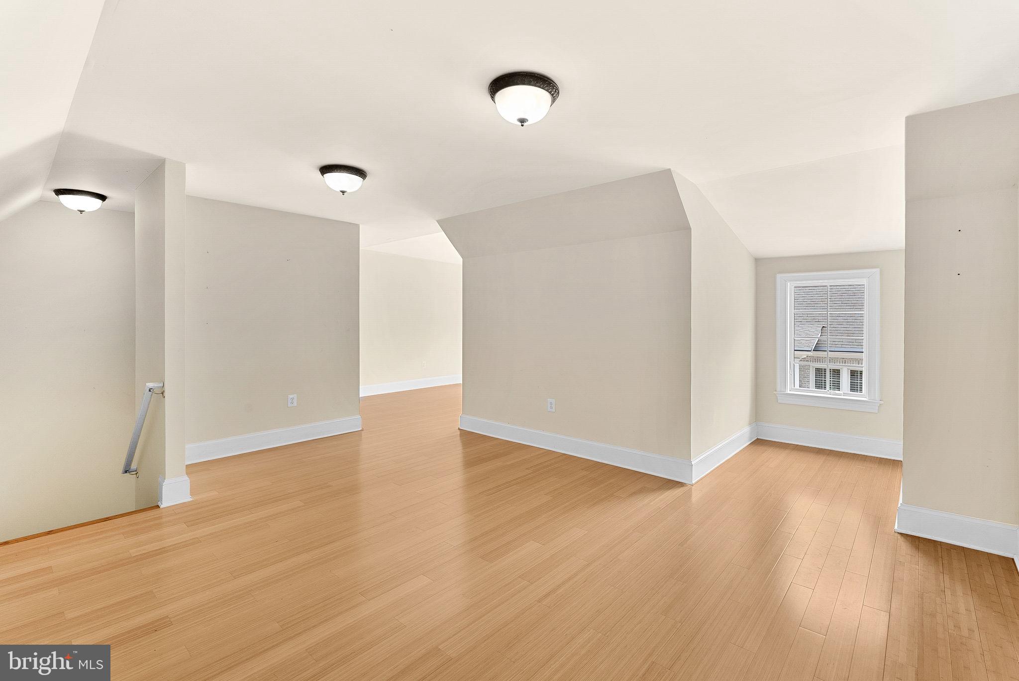 11913 Chapel Road Clifton, VA 20124 - Photo 119 of 124 a view of an empty room with wooden floor and a window