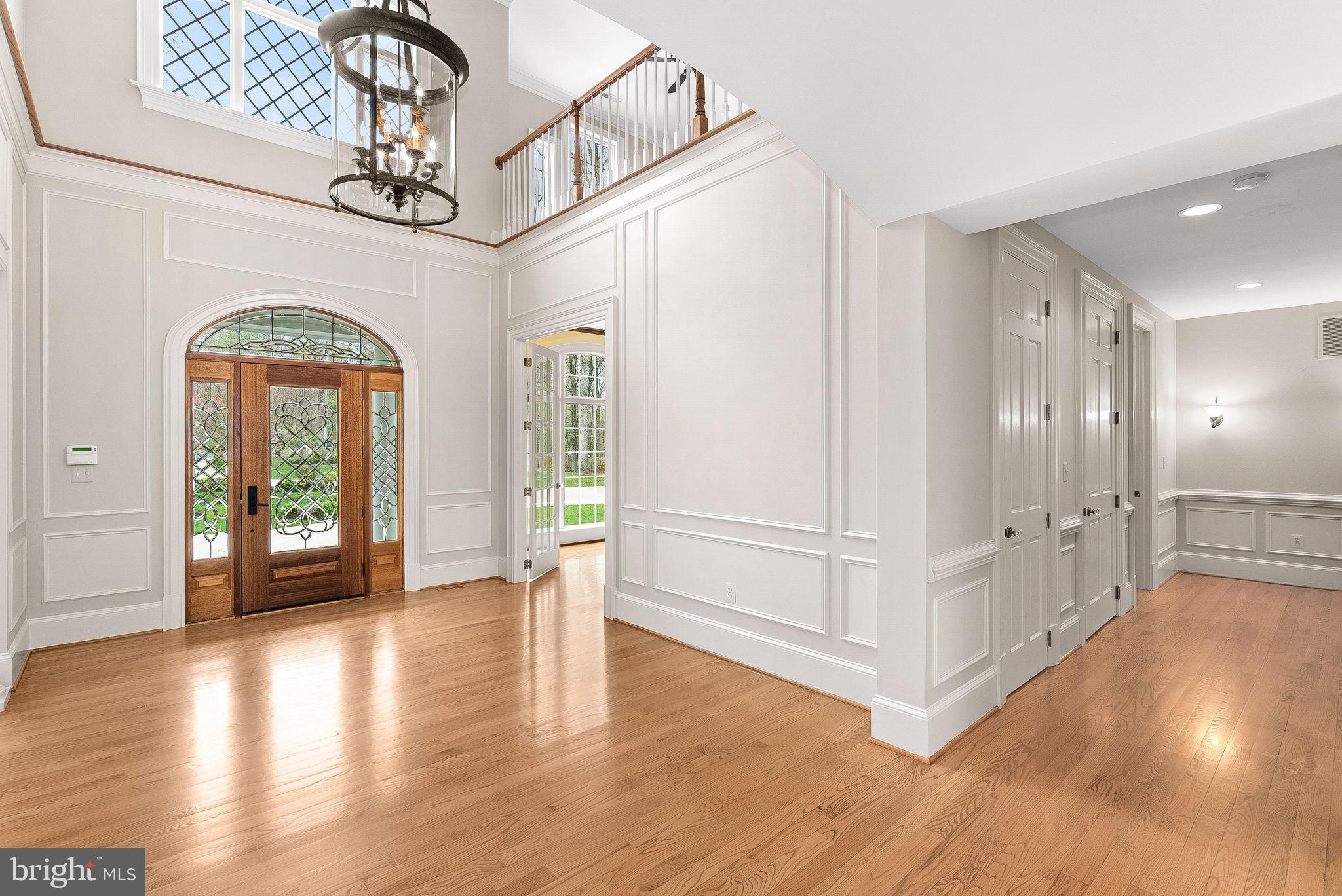 11913 Chapel Road Clifton, VA 20124 - Photo 26 of 124 a view of a big room with wooden floor windows and a chandelier