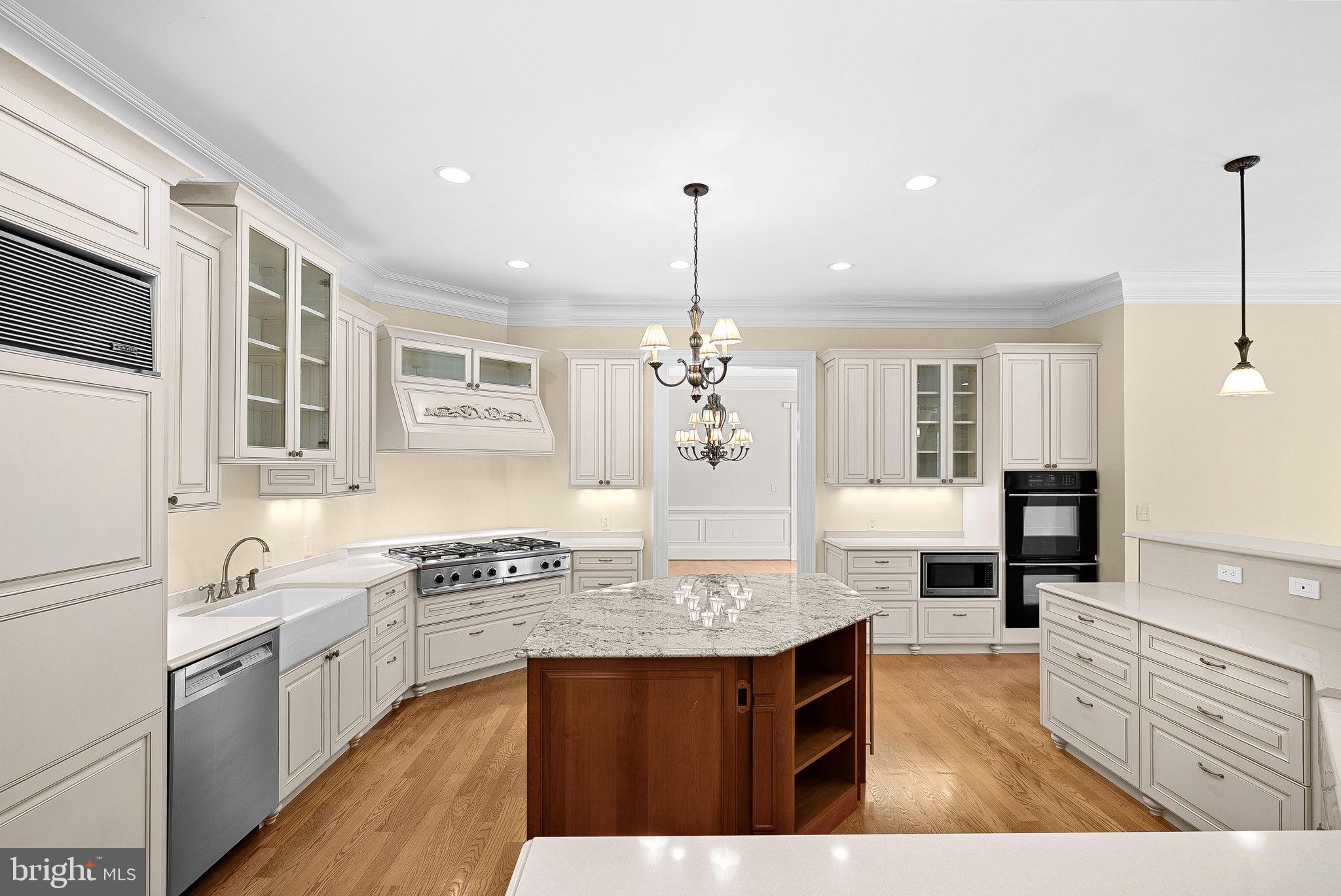 11913 Chapel Road Clifton, VA 20124 - Photo 33 of 124 a kitchen with granite countertop a sink cabinets and wooden floor