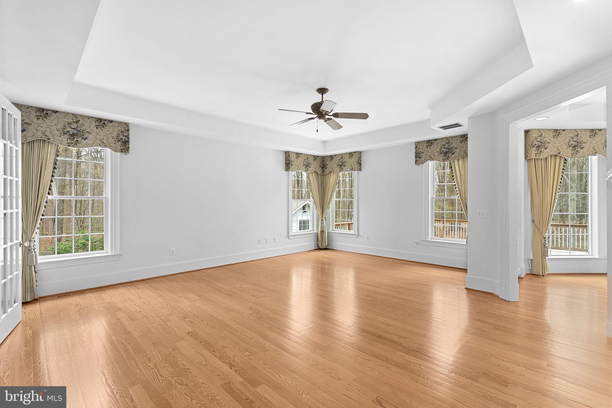 11913 Chapel Road Clifton, VA 20124 - Photo 60 of 124 a view of an empty room with a window and wooden floor