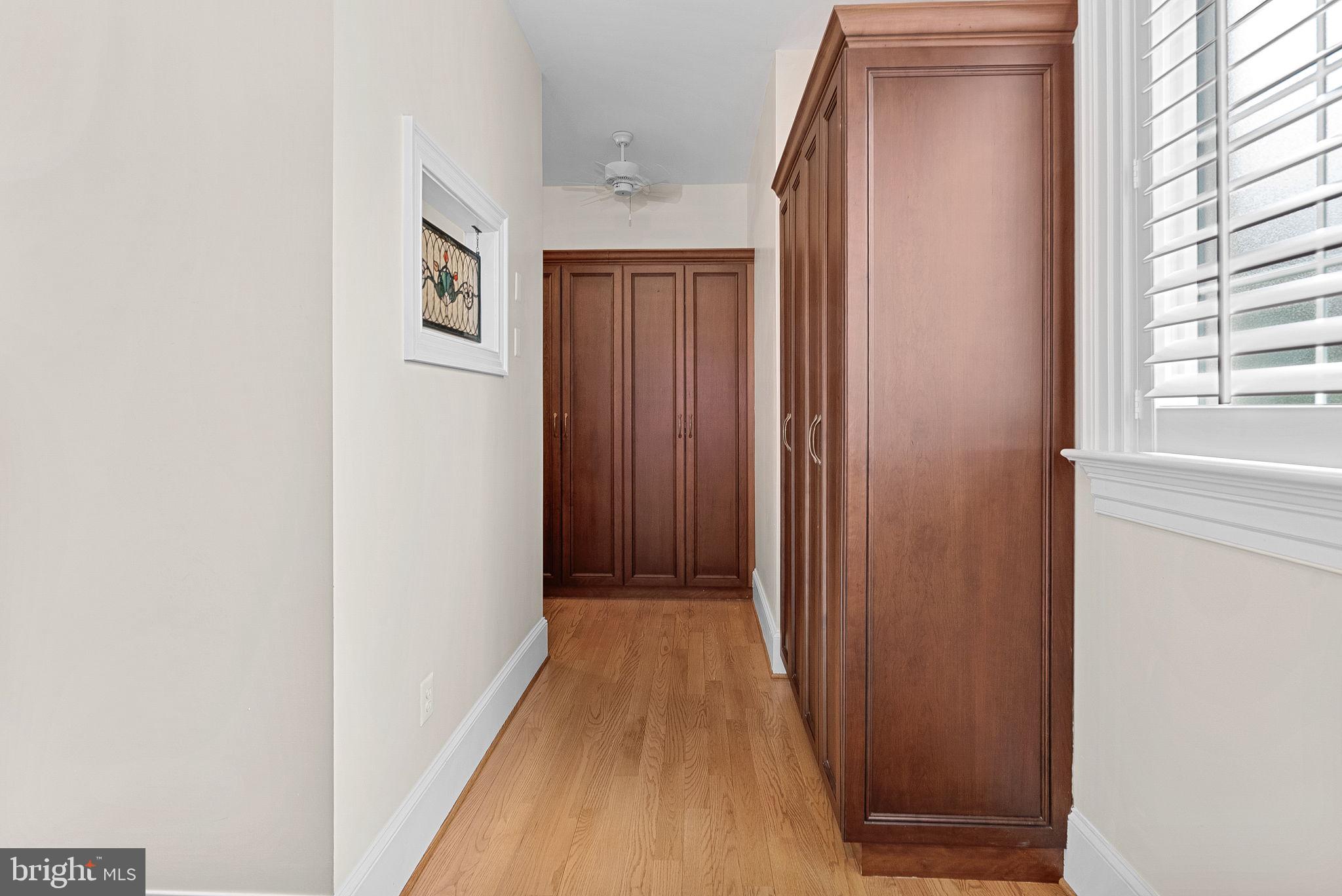 11913 Chapel Road Clifton, VA 20124 - Photo 73 of 124 a view of a hallway with wooden floor and windows