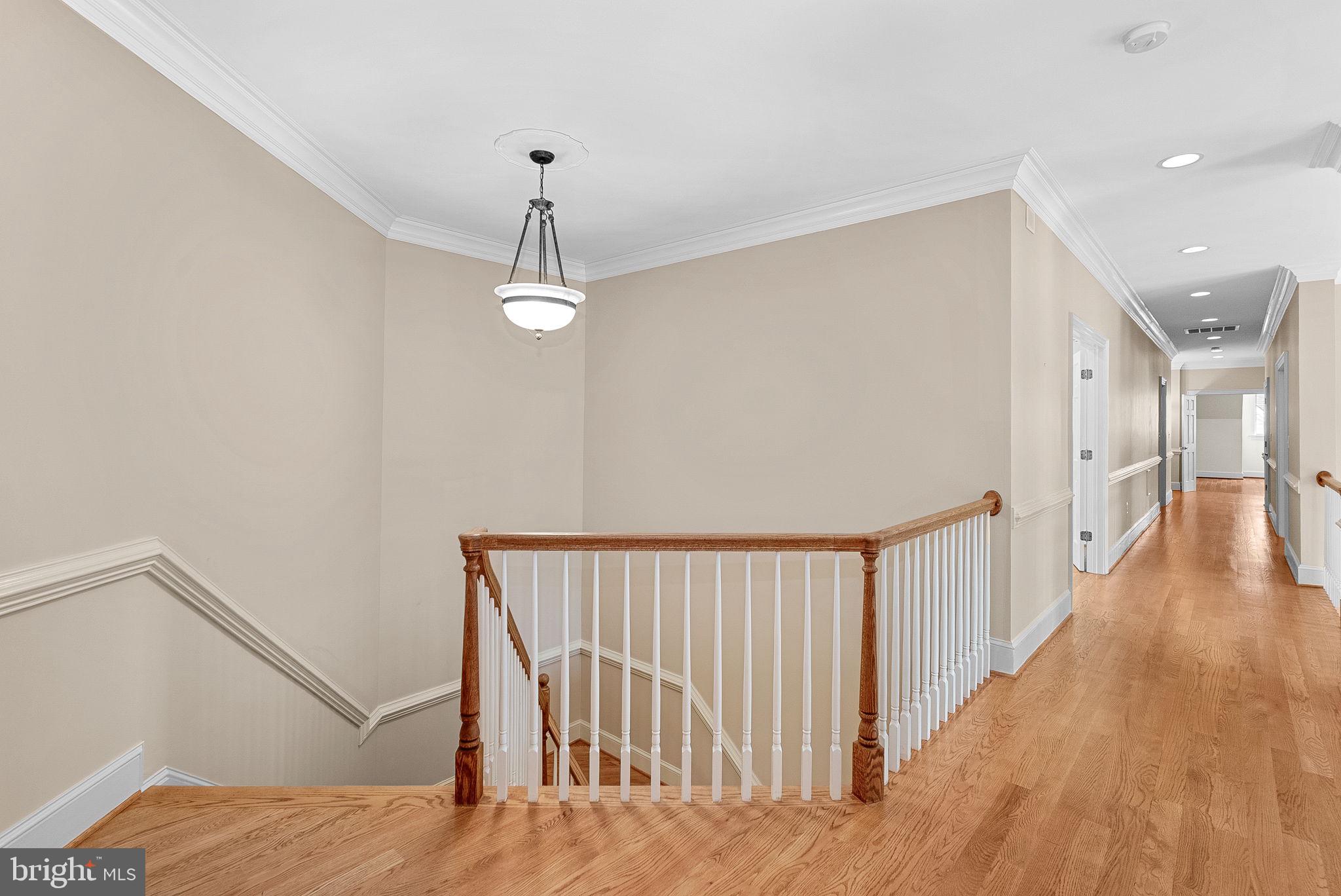 11913 Chapel Road Clifton, VA 20124 - Photo 74 of 124 a view of a hallway with wooden floor and staircase