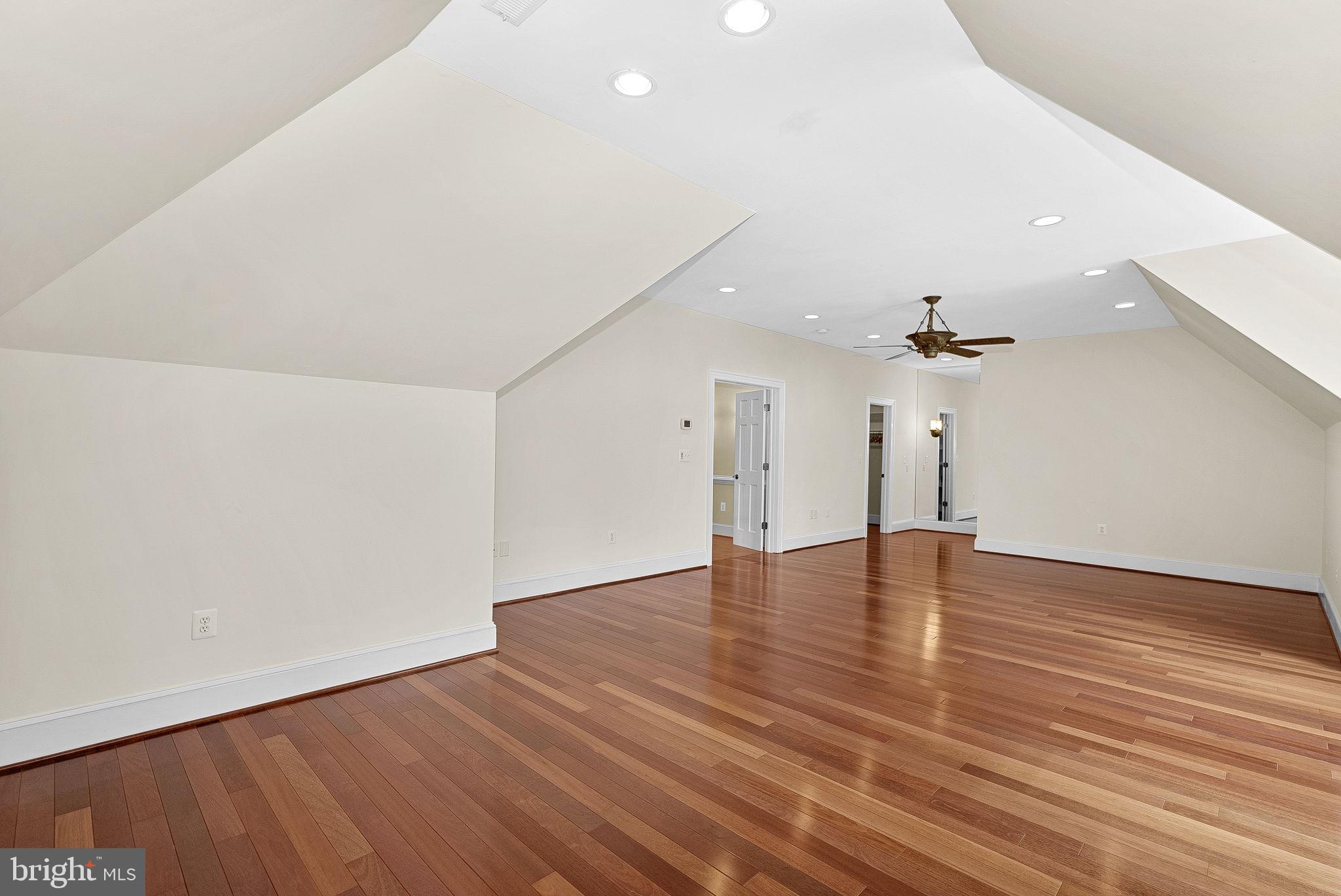 11913 Chapel Road Clifton, VA 20124 - Photo 80 of 124 an empty room with wooden floor and ceiling fan