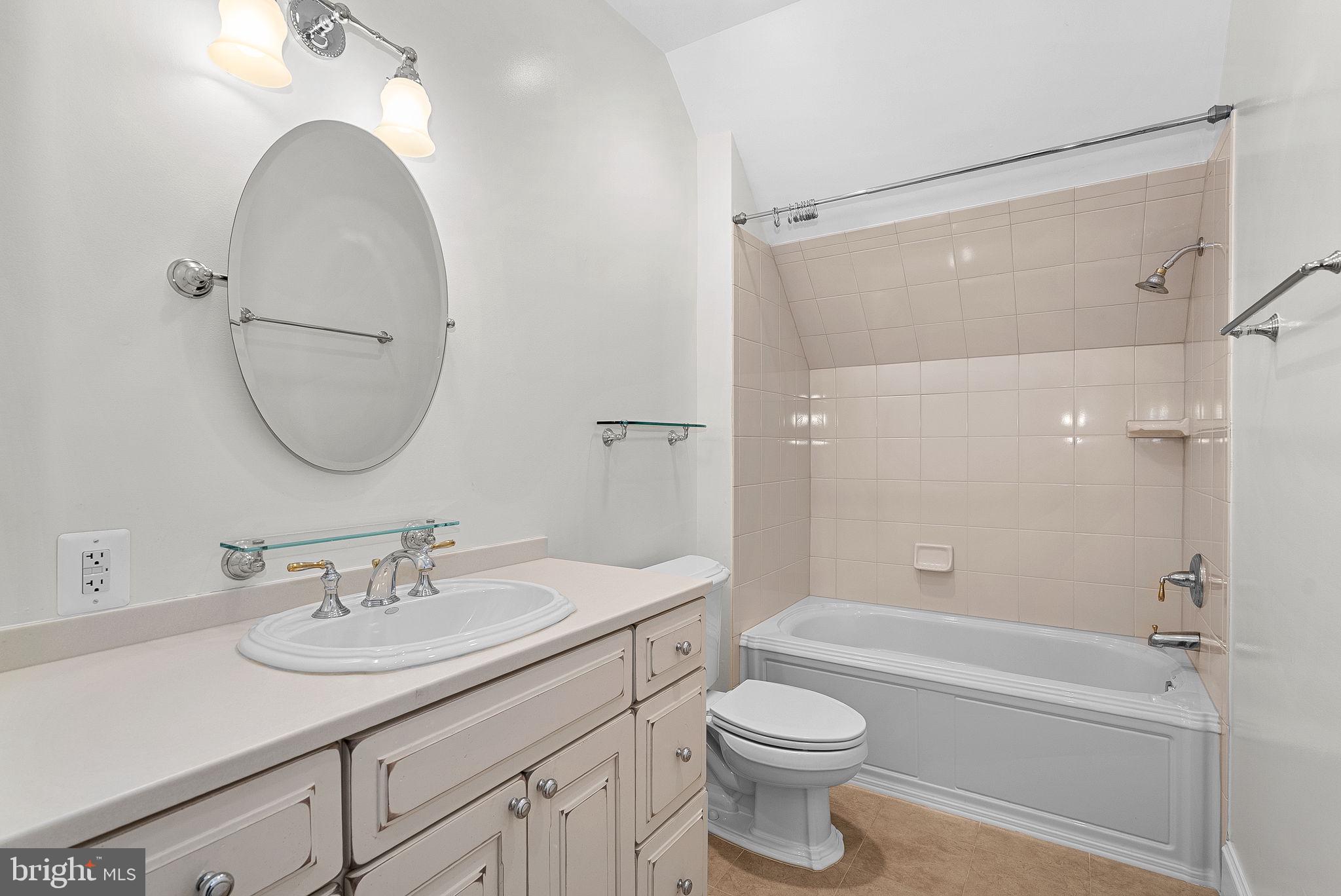 11913 Chapel Road Clifton, VA 20124 - Photo 82 of 124 a bathroom with a sink a toilet and a mirror