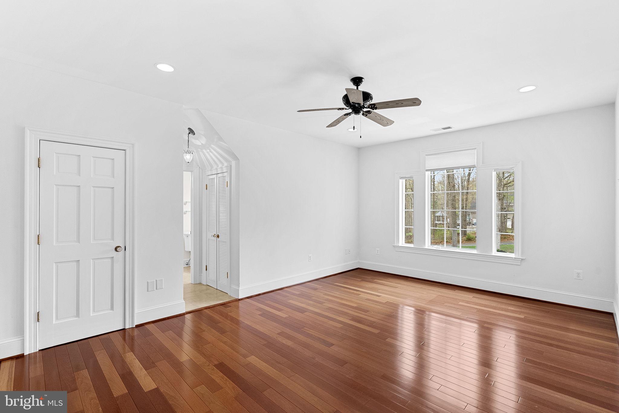 11913 Chapel Road Clifton, VA 20124 - Photo 86 of 124 a view of empty room with wooden floor and fan