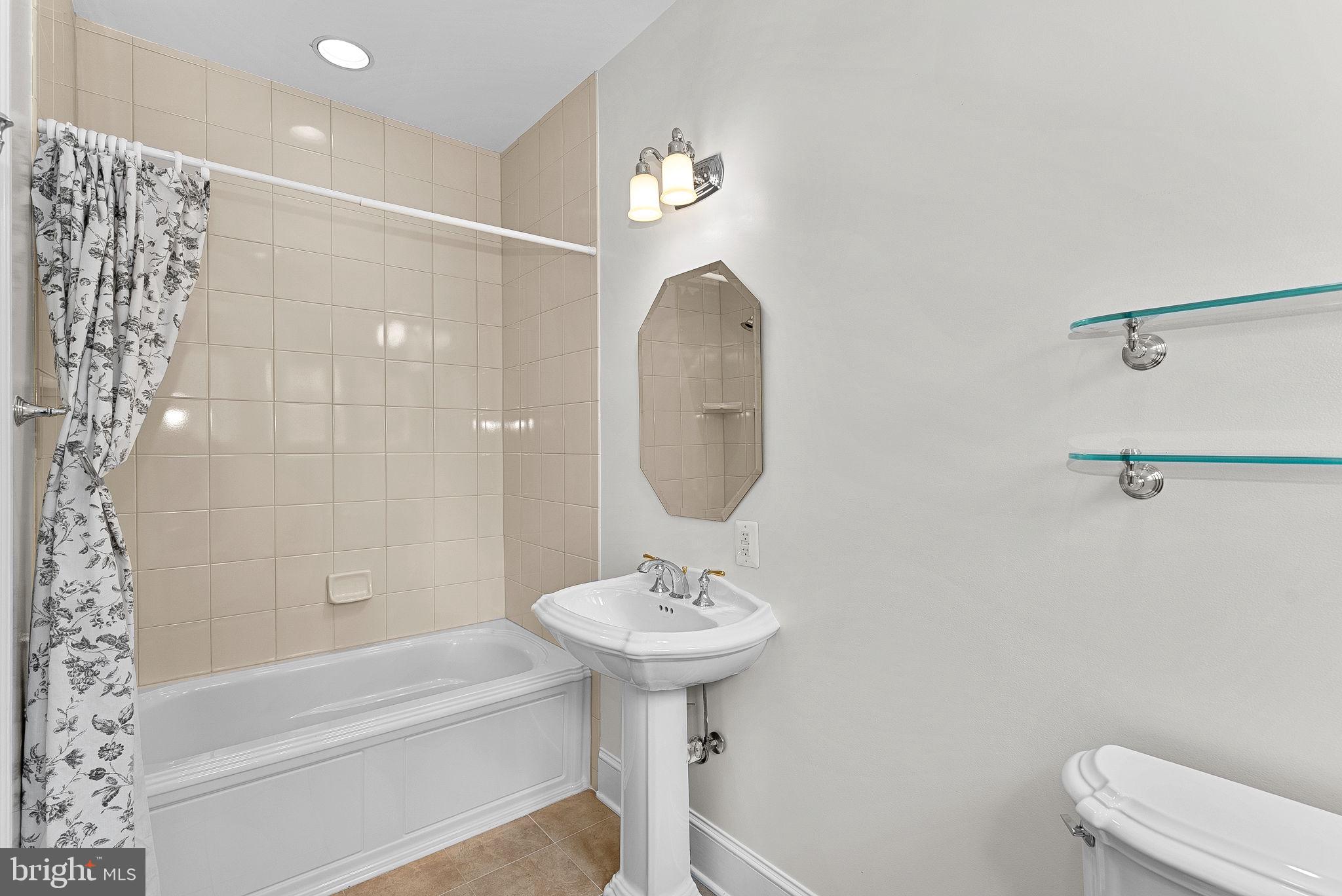 11913 Chapel Road Clifton, VA 20124 - Photo 89 of 124 a bathroom with a sink a toilet and a bathtub