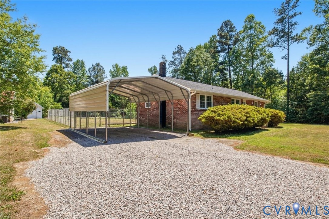 15503 Eppes Road Dewitt, VA 23840 - Photo 8 of 22 a view of a house with backyard and trees