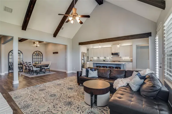 a living room with furniture and a table
