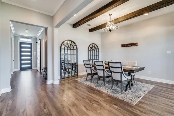 a view of a livingroom with furniture and wooden floor