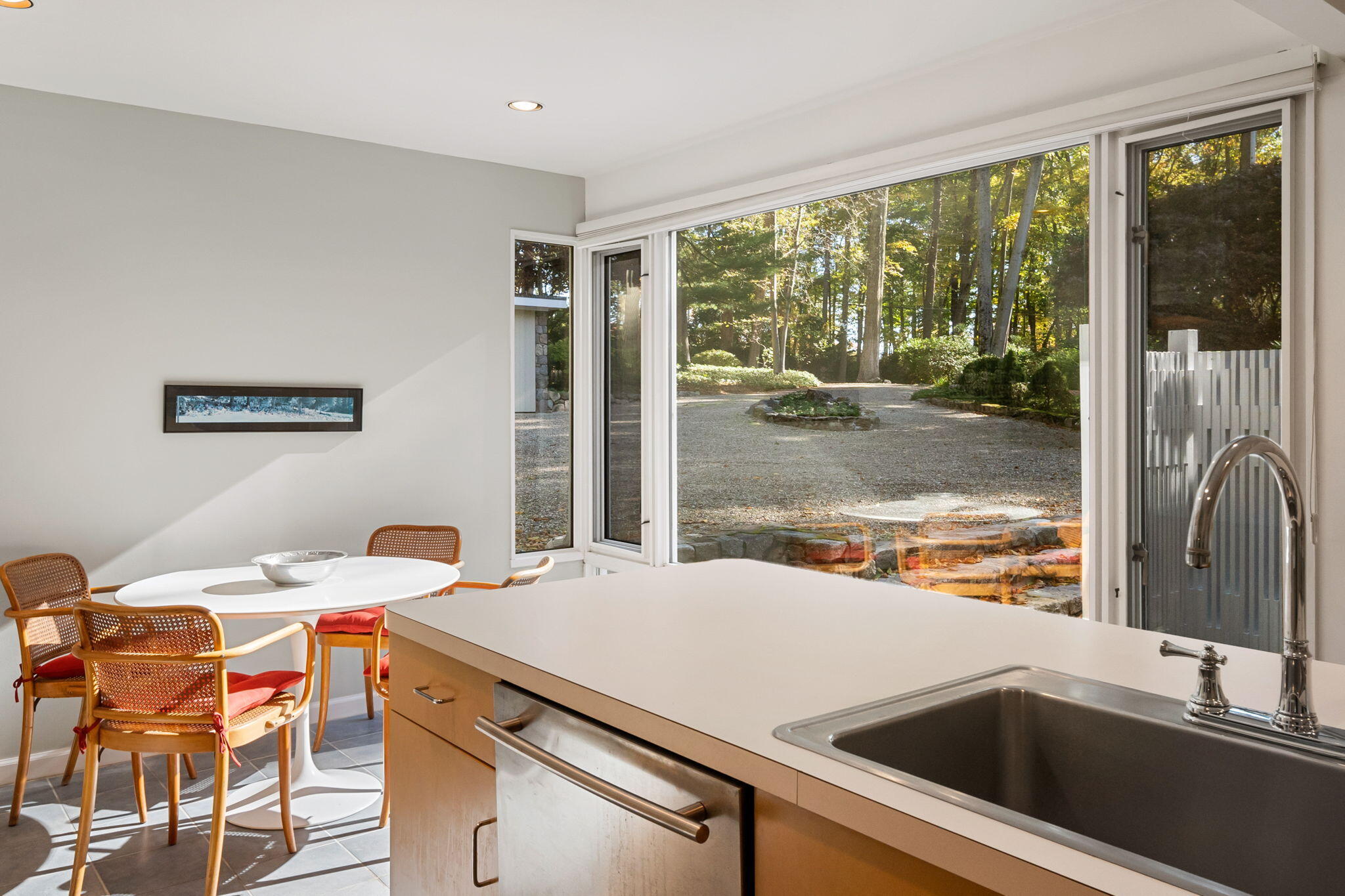 154 Indian Rock Road New Canaan, CT 06840 - Photo 12 of 33 a view of a kitchen with a sink and large window