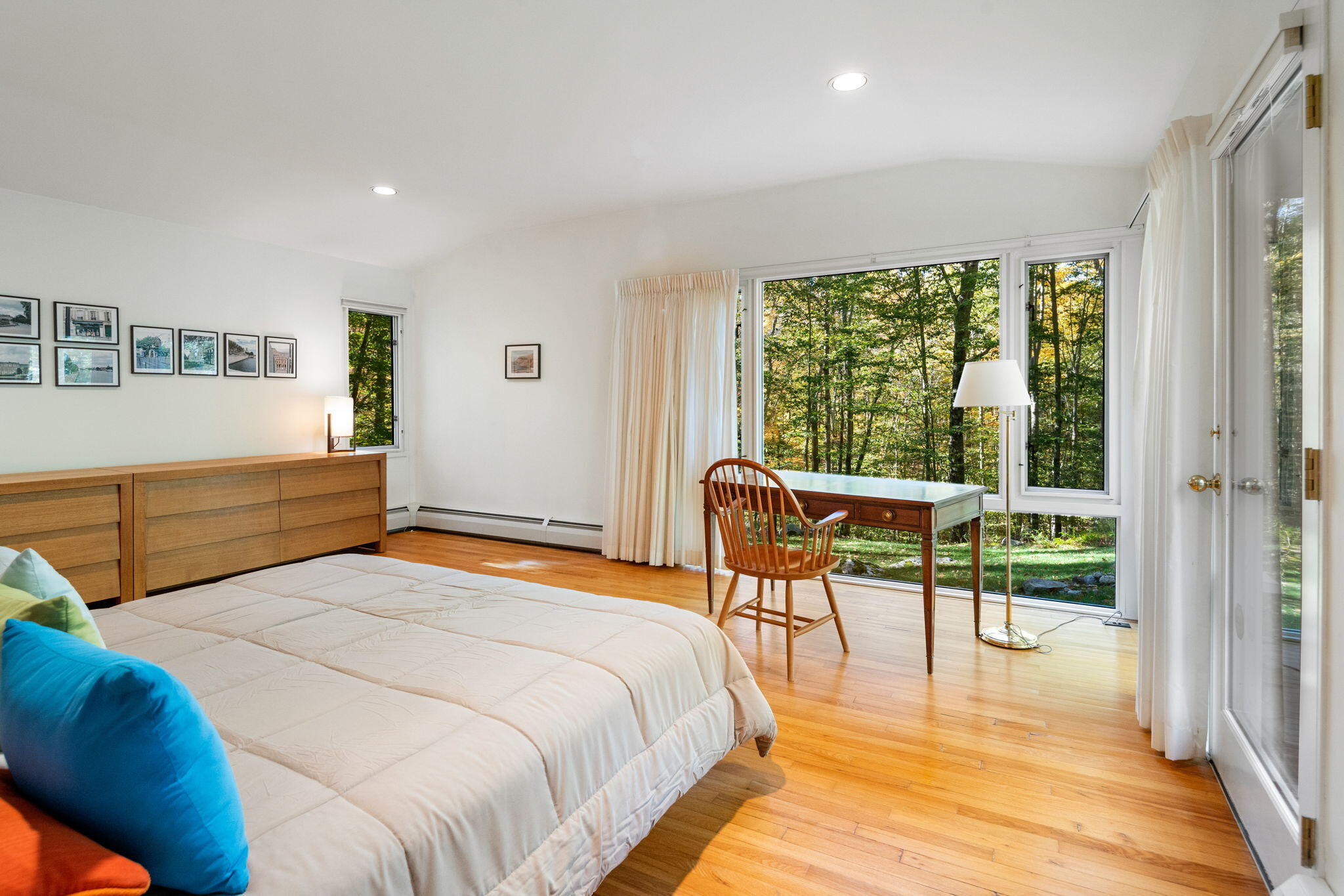 154 Indian Rock Road New Canaan, CT 06840 - Photo 13 of 33 a bedroom with a bed and a large window