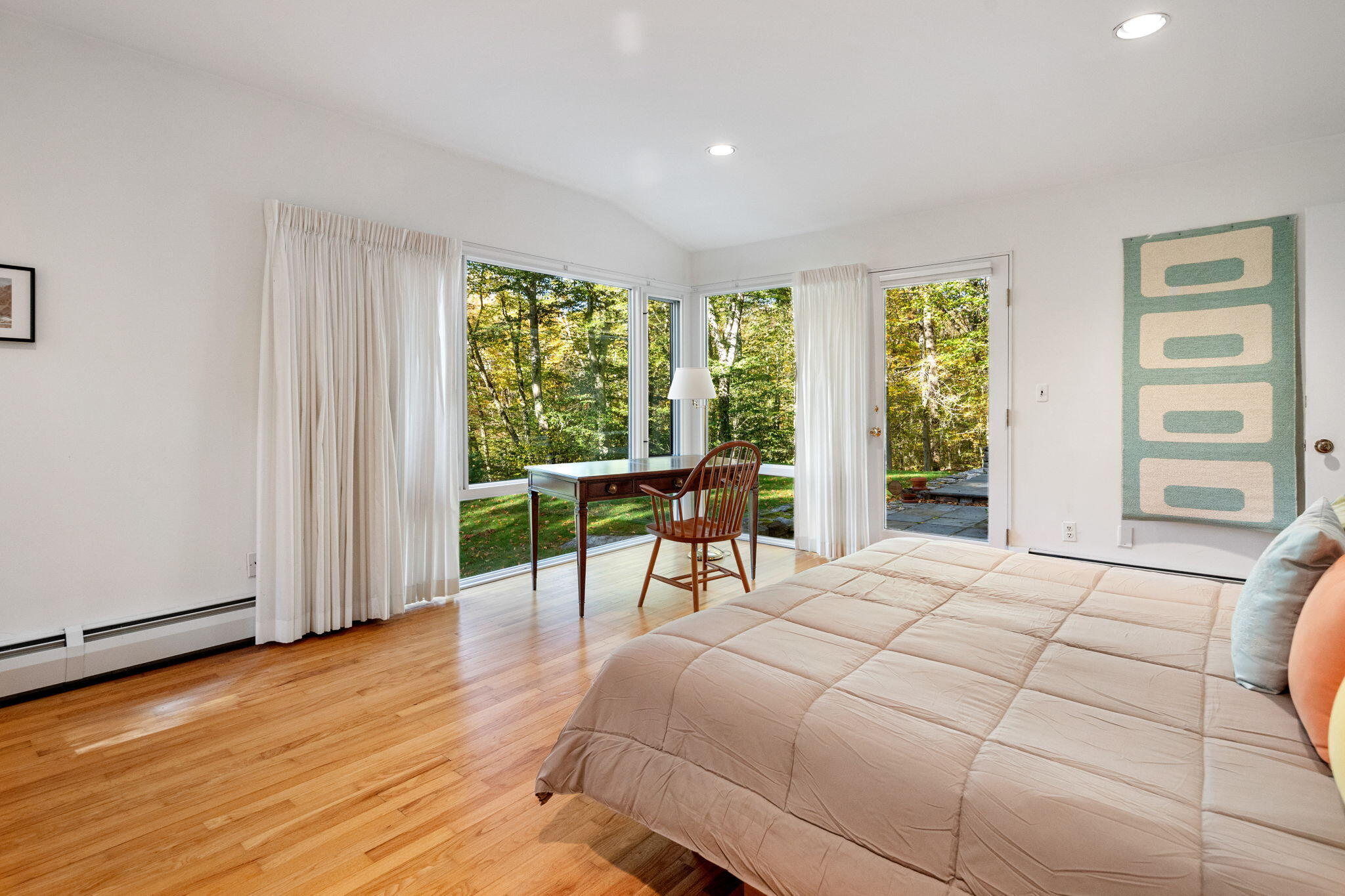 154 Indian Rock Road New Canaan, CT 06840 - Photo 14 of 33 a bedroom with a bed and a large window