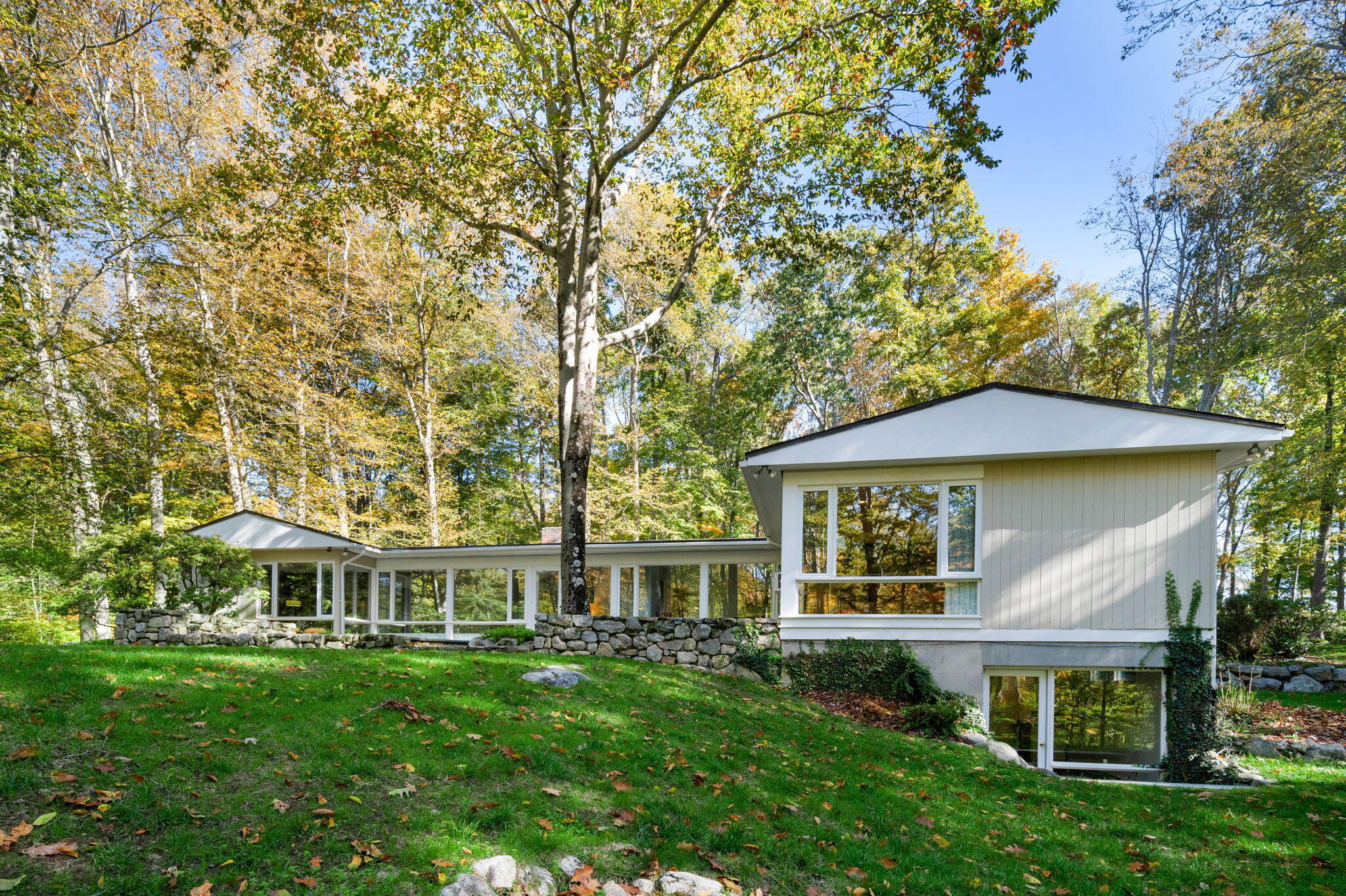 154 Indian Rock Road New Canaan, CT 06840 - Photo 24 of 33 front view of a house with a garden