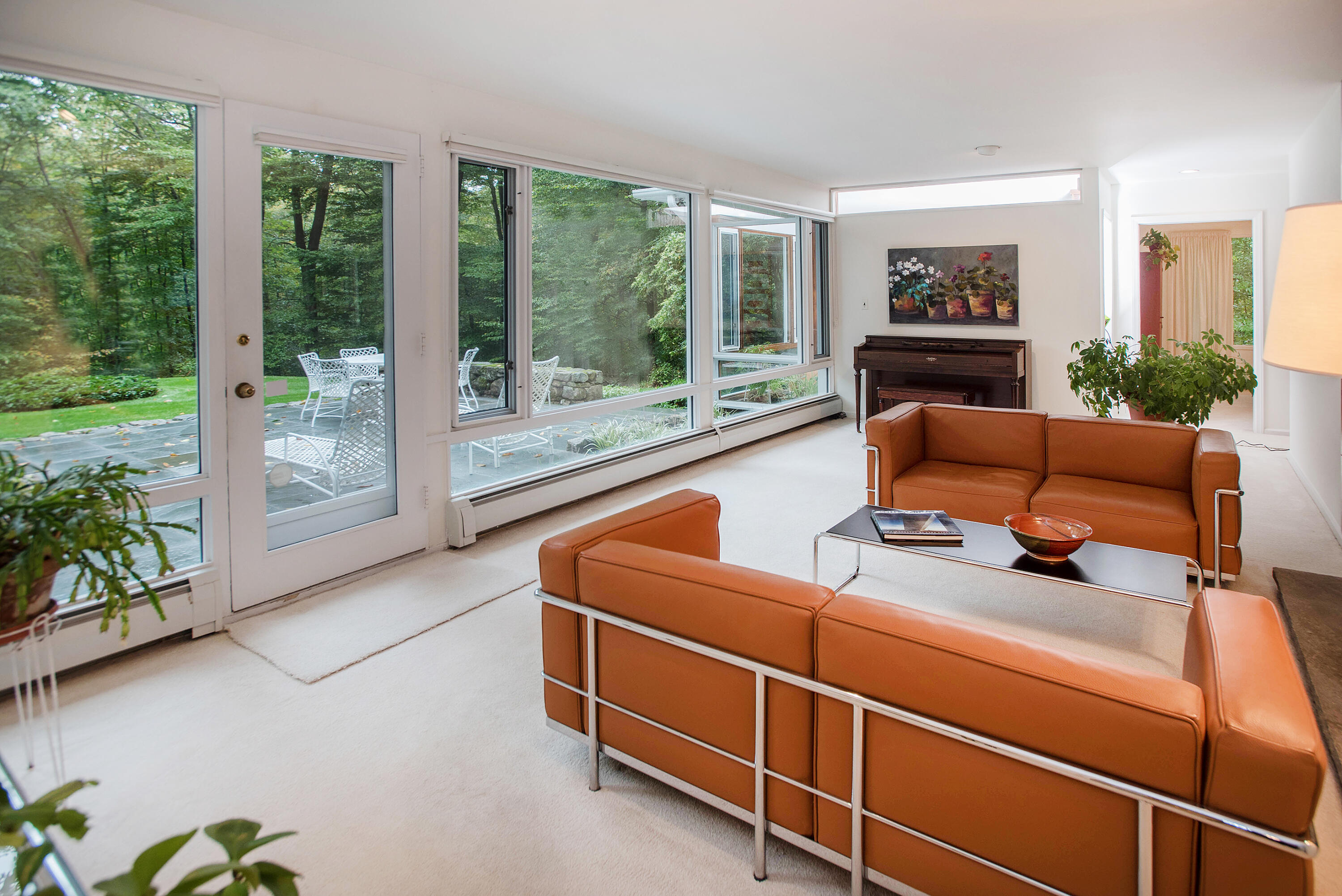 154 Indian Rock Road New Canaan, CT 06840 - Photo 7 of 33 a living room with furniture and a floor to ceiling window