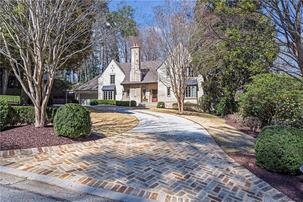 333 Pineland Road Northwest Atlanta, GA 30342 - Photo 1 of 1 a front view of a house with a yard