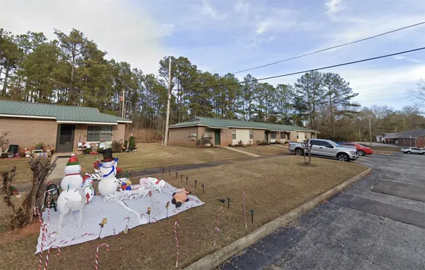 a house view with a backyard space