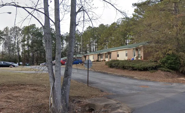 a view of a car in front of a house